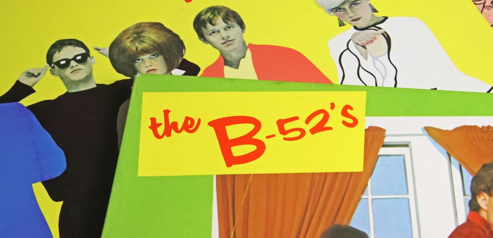 Closeup of colorful fancy vinyl record covers of B-52s band from the 80s