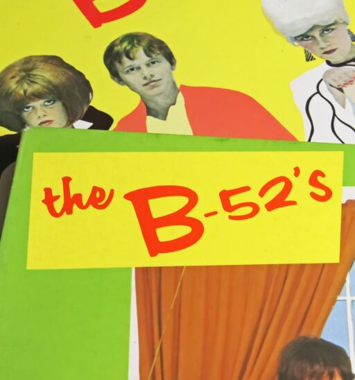 Closeup of colorful fancy vinyl record covers of B-52s band from the 80s