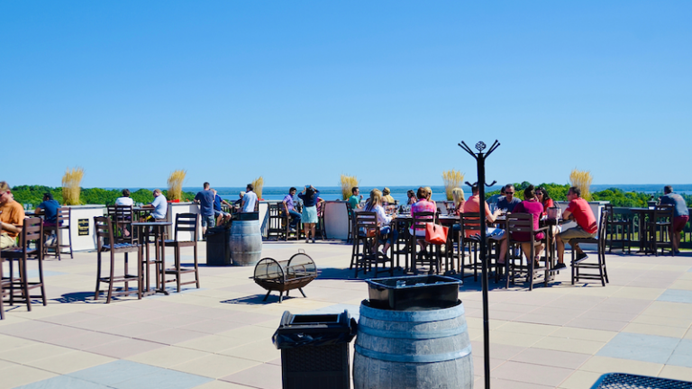 People enjoying the wine tastings and relaxing atmosphere at the Chateau Chantal Winery, on Old Mission Peninsula, Traverse City.