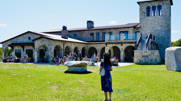 People enjoying the wine tastings, relaxing atmosphere and beautiful view at the famous Mari Vineyards, on Old Mission Peninsula, Traverse City.