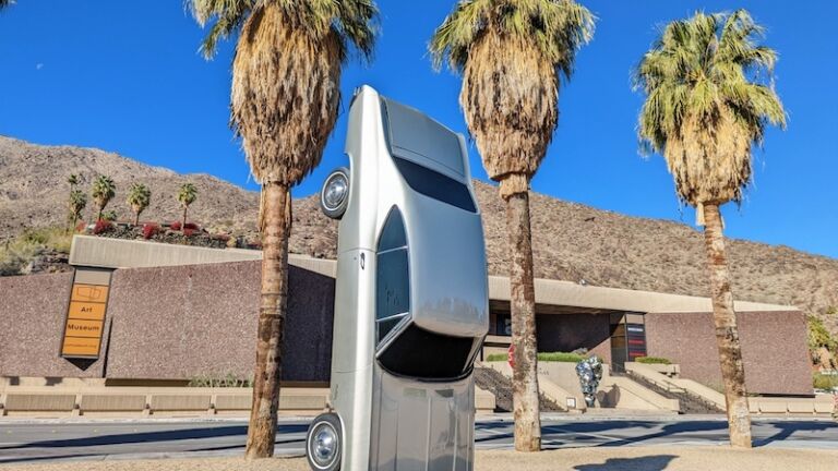 "History of Suspended Time: Monument for the Impossible" art installation by Gonzalo Lebrija, with the Palm Springs Art Museum in the background.