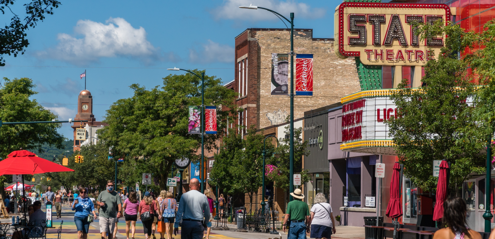 Traverse City, MI, US-August 16, 2020: Busy Front Street in downtown with State Street Theater.