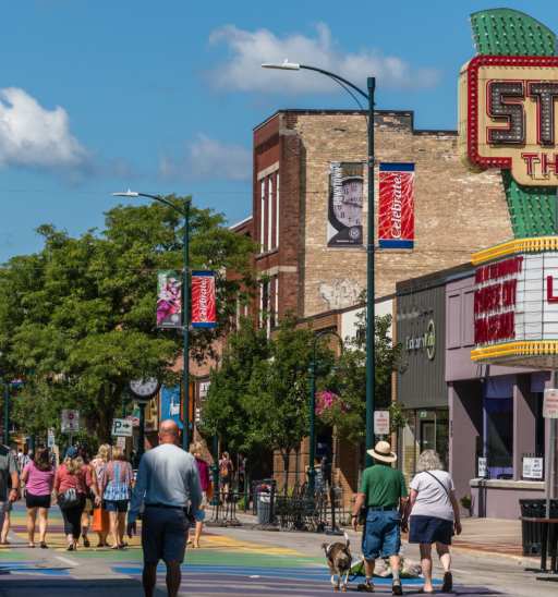 Traverse City, MI, US-August 16, 2020: Busy Front Street in downtown with State Street Theater.