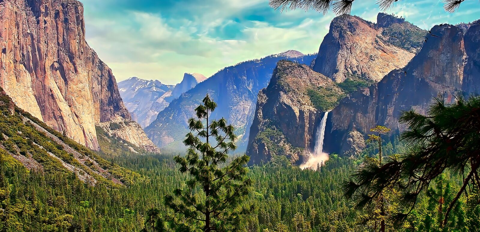 A panoramic view of the iconic Yosemite Valley in the Springtime, showing Bridalveil Falls and El Capitan.